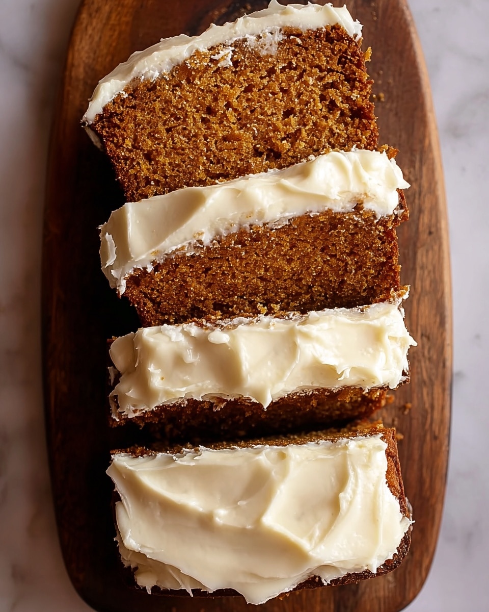 The image shows three thick slices of a moist, dense cake with a brown crumb and fine texture, stacked closely on top of each other on a brown wooden board. Each slice is topped with a smooth layer of creamy white frosting that gently drapes over the edges, with slight waves and soft peaks giving a rich, fluffy appearance. The cake has a slightly coarse crumb with small holes visible, contrasting with the smoothness of the frosting on top. The background is a white marbled texture. Photo taken with an iphone --ar 4:5 --v 7