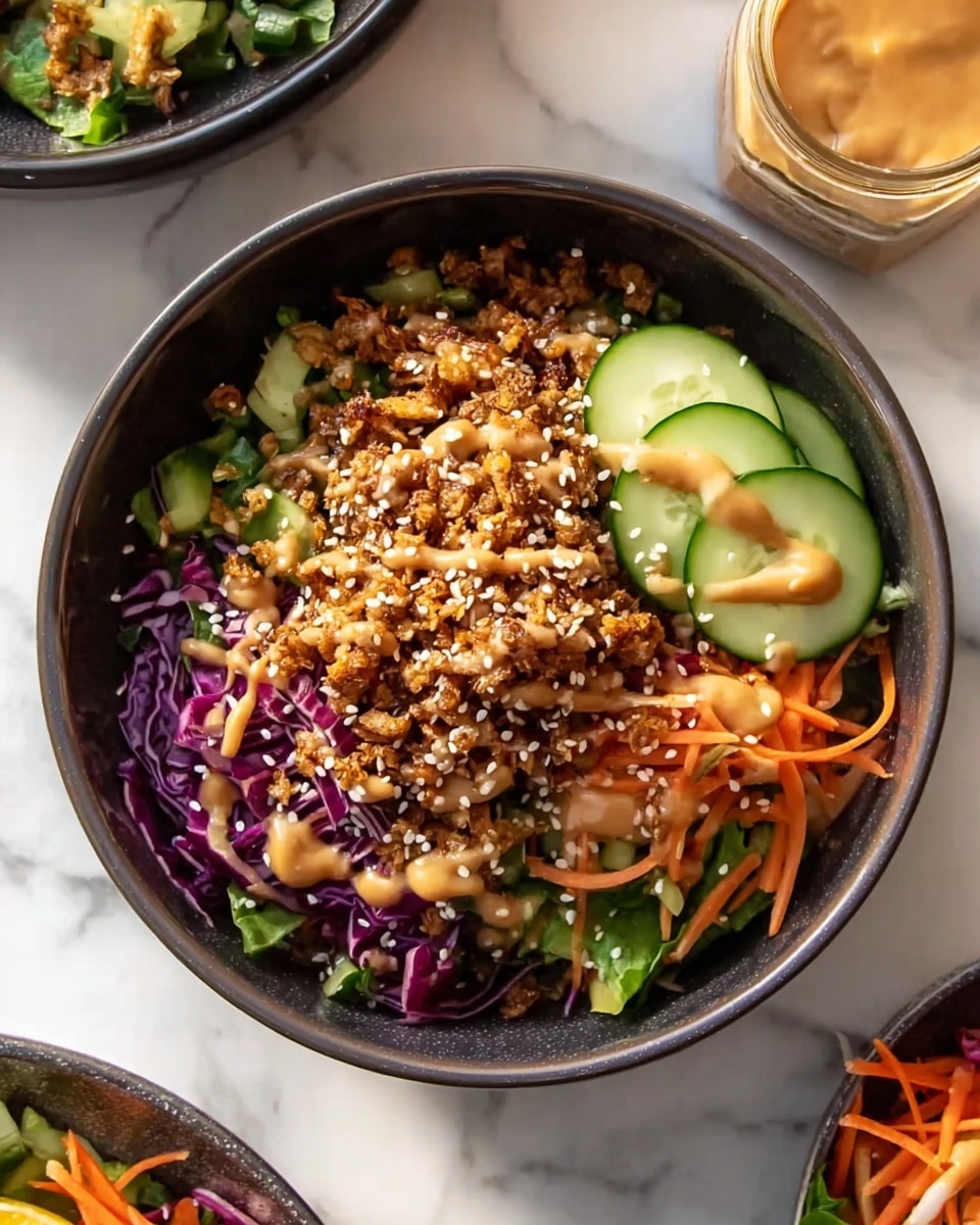 A dark bowl filled with a colorful salad showing three layers: the bottom layer is chopped purple cabbage and green leafy vegetables, mixed with thin slices of bright orange carrots scattered throughout. The middle layer has thin, circular slices of light green cucumber positioned on one side of the bowl. The top layer consists of crunchy brown granola-like pieces sprinkled generously with white sesame seeds and drizzled with a creamy, light brown dressing. The bowl is set on a white marbled surface with parts of another dish and jar visible around. photo taken with an iphone --ar 4:5 --v 7