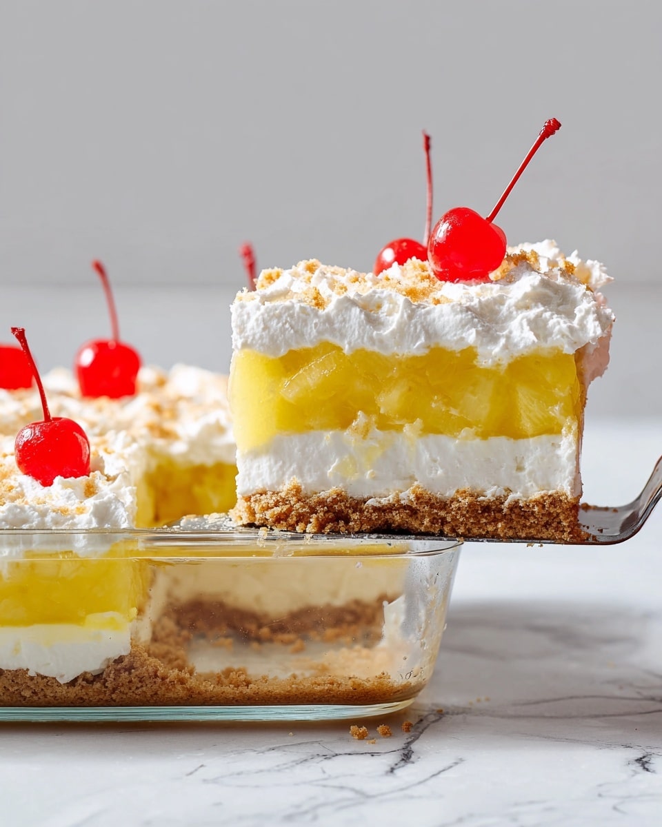 A clear dish shows a layered dessert with four layers: the bottom layer is a brown crumbly crust, above it is a smooth white cream layer, followed by a thick yellow fruit layer with some translucent texture, and a fluffy white whipped topping sprinkled with light brown crumbs. Three bright red cherries with stems sit on top of the dessert, with one cherry placed on the slice being lifted out. The slice is held by a metal spatula, above a white marbled surface background. photo taken with an iphone --ar 4:5 --v 7